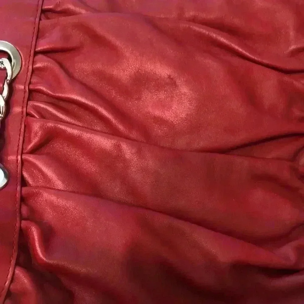 Desmo red leather shoulder bag with silver link hardware.
